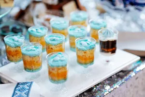 Vibrant layered desserts with blue frosting, perfect for parties and celebrations. jigsaw puzzle
