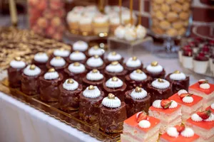 Close-up of assorted pastries and sweets artfully arranged on a dessert table. jigsaw puzzle