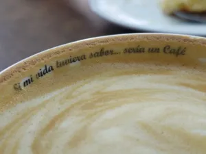 Close-up of a coffee latte in a cup with an inspirational quote. jigsaw puzzle