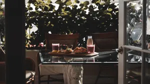 A cozy morning breakfast setup with smoothies and pastries on a sunlit table. jigsaw puzzle