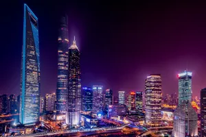 Majestic view of Shanghai's illuminated skyline featuring iconic skyscrapers at night. jigsaw puzzle