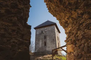 Stone medieval tower framed by rugged walls under a clear sky in Podgarić, Croatia. jigsaw puzzle