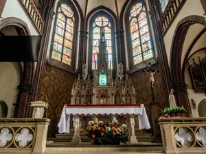 Beautiful gothic church altar adorned with stained glass and intricate designs. jigsaw puzzle