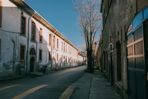 A quiet European street lined with historical architecture, capturing a serene atmosphere. jigsaw puzzle