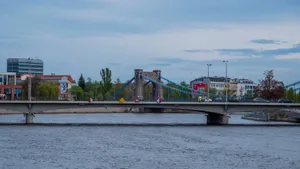 View of Grunwald Bridge with city buildings by the river. jigsaw puzzle