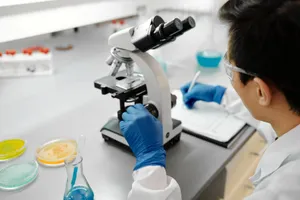 Scientist using a microscope to analyze samples in a modern laboratory environment. jigsaw puzzle
