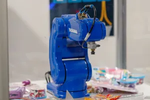 A blue Yaskawa industrial robot arm on display, showcasing advanced technology and robotics. jigsaw puzzle