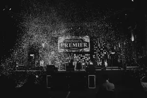 Dynamic black and white photo of a live concert with confetti shower on stage. jigsaw puzzle