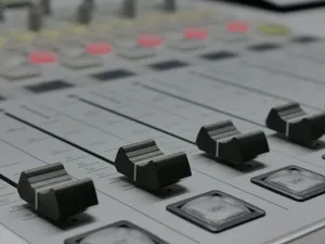 Detailed view of audio mixer sliders in a recording studio setting. jigsaw puzzle