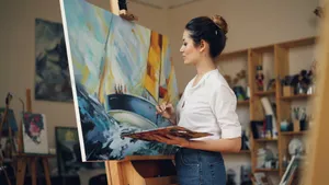 Female artist creating vibrant painting in her art studio. jigsaw puzzle