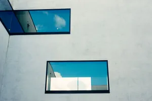 Abstract view of modern architecture featuring reflective glass and geometric lines. jigsaw puzzle
