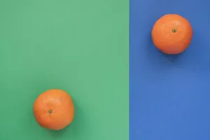 Fresh oranges on green and blue background, highlighting their vibrant color in a flat lay style. jigsaw puzzle
