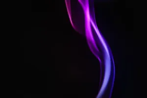 Abstract purple smoke on a black background, capturing motion and glow. jigsaw puzzle