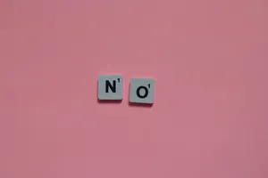 Letters N and O from a word game on a pink background. Minimalist and playful. jigsaw puzzle
