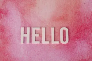 Pink textured background with bold white 'HELLO' text for greetings and communication. jigsaw puzzle
