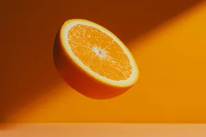 a half of an orange sitting on top of a table jigsaw puzzle
