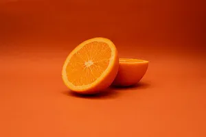 sliced lemon on orange surface jigsaw puzzle