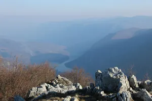 Rocky mountain peak overlooking a misty river valley jigsaw puzzle