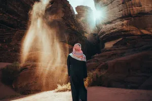 a person standing in front of a rock formation jigsaw puzzle