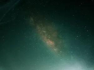 a person standing on a hill under a night sky jigsaw puzzle