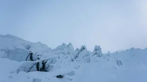 a mountain covered in lots of snow with a sky background jigsaw puzzle