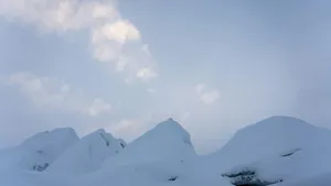 a snow covered mountain under a cloudy sky jigsaw puzzle