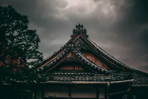 black roof house beside tree jigsaw puzzle