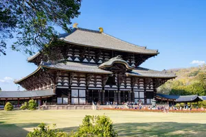 a large wooden building sitting on top of a lush green field jigsaw puzzle