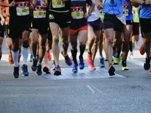 people running on gray asphalt road during daytime jigsaw puzzle