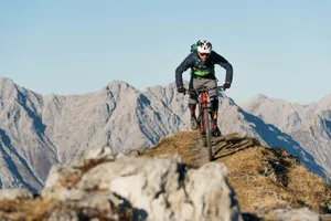 a man riding a bike on a mountain jigsaw puzzle