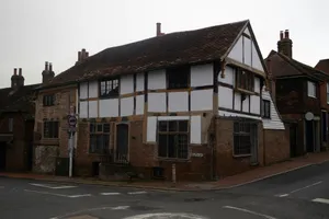 Historic timber-framed building on a street corner. jigsaw puzzle