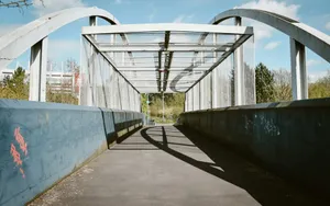 Modern pedestrian bridge with arched roof structure. jigsaw puzzle