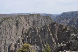 Explore the stunning rocky cliffs and rugged mountain range for a breathtaking view of nature's geology. jigsaw puzzle