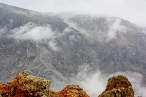 Explore the dramatic misty peaks of Divriği, Türkiye, amidst clouds and rugged terrain. jigsaw puzzle