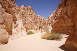 Breathtaking view of a desert canyon in Egypt with striking rock formations under clear blue skies. jigsaw puzzle