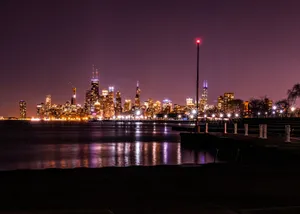 Vibrant Chicago skyline illuminated at night with reflections on Lake Michigan. jigsaw puzzle