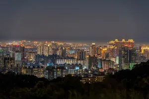 Stunning view of Taipei's skyline at night, showcasing illuminated skyscrapers and vibrant city lights. jigsaw puzzle
