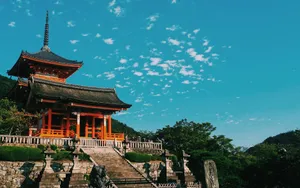 Beautiful view of Kiyomizu Dera Temple in Kyoto, showcasing traditional Japanese architecture under a vibrant sky. jigsaw puzzle