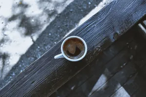 Aerial view of a ceramic coffee cup on an old wooden table, offering a rustic vibe. jigsaw puzzle