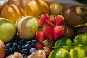 A close-up of fresh assorted fruits including strawberries, kiwis, and green apples with water droplets. jigsaw puzzle