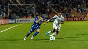 Intense soccer match showcasing players vying for control of the ball on a vibrant, well-lit field. jigsaw puzzle