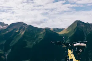 Explore breathtaking mountain landscapes with a close-up of a bicycle. jigsaw puzzle