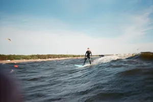 Experience the thrill of surfing on turbulent ocean waves under a bright summer sky. jigsaw puzzle