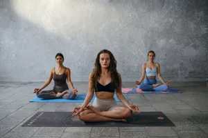 Three women meditating in a yoga class indoors, focusing on mindfulness and wellness. jigsaw puzzle