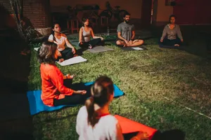 A group practicing meditation and yoga outdoors at night, fostering relaxation and mindfulness. jigsaw puzzle