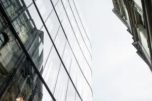 Low angle view of modern glass buildings reflecting the cityscape in Prague. jigsaw puzzle