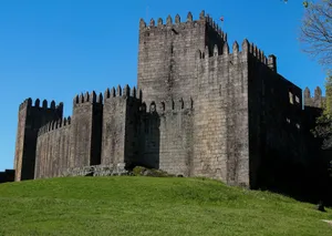 Explore the historic Guimarães Castle, a stunning example of medieval architecture in Portugal. jigsaw puzzle