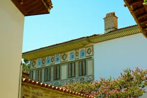 Beautiful traditional building with ornate design and flowers, captured on a sunny day. jigsaw puzzle