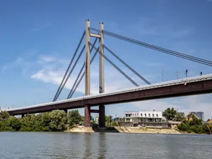 Capture of a modern railway bridge crossing the river in Belgrade under a clear blue sky. jigsaw puzzle
