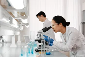 Two scientists in a lab examining samples with a microscope. Focus on scientific research and discovery. jigsaw puzzle